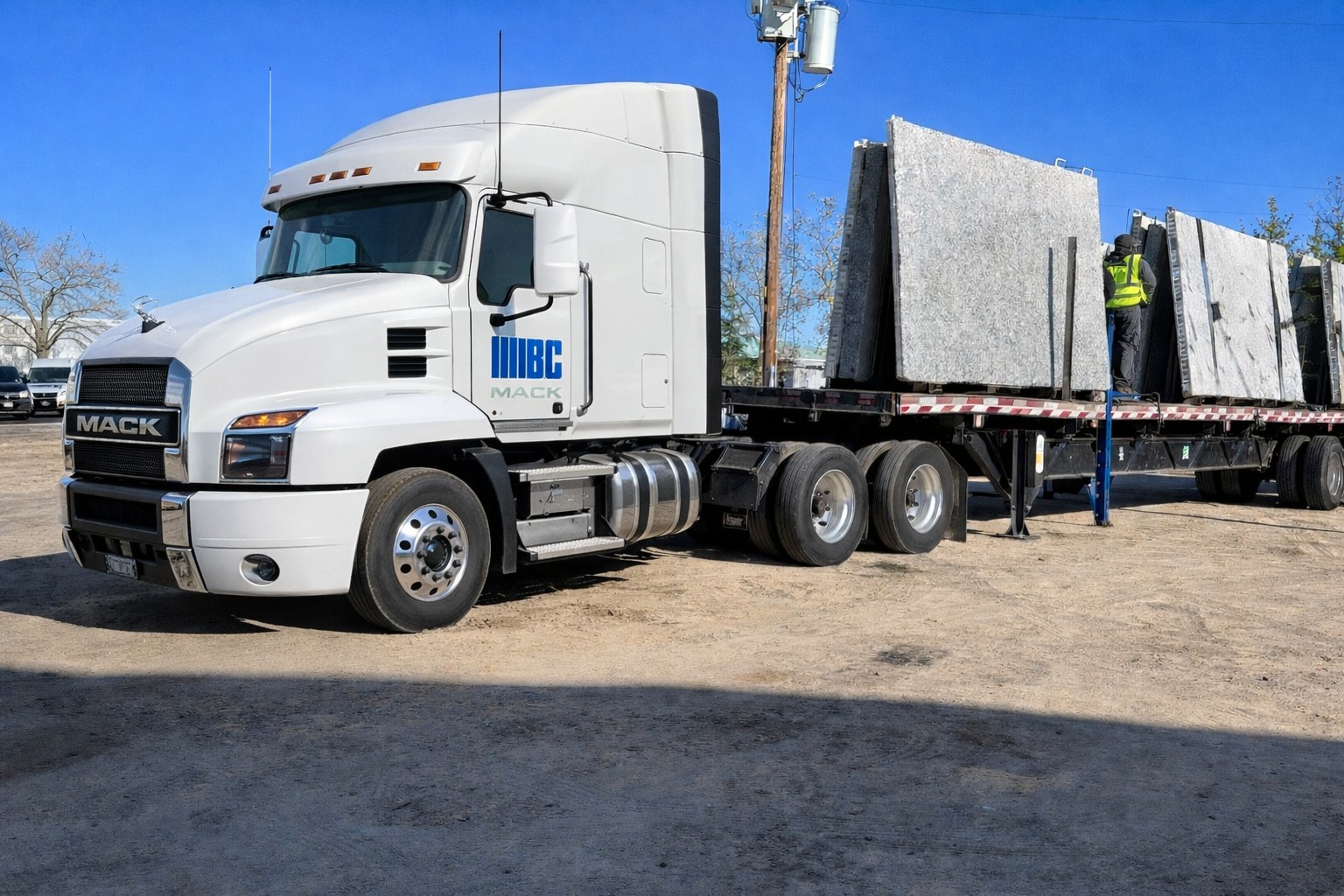Flatbed truck delivering stone slabs
